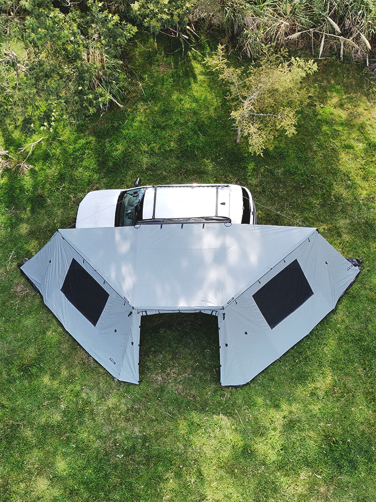Aerial view of the Lucas Creek 180 Fantail free standing awning with the outer wall kit installed with door fully open