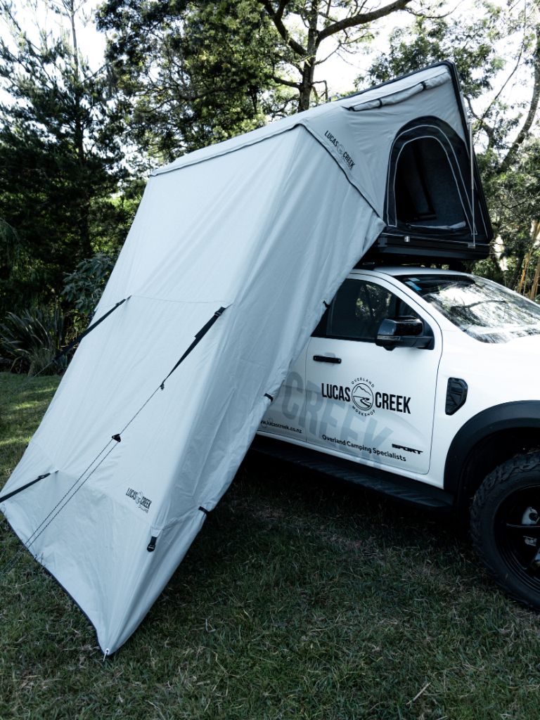 Side view of the 3 wall annex for the D-Luxe showing the roll up door for entry to the annex and the ladder