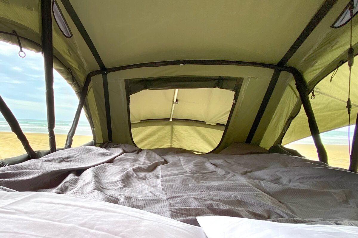 Inside the Lucas Creek Roof Top Tent on beach in New Zealand